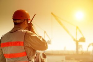 35391291 - worker with large crane site and sunset background
